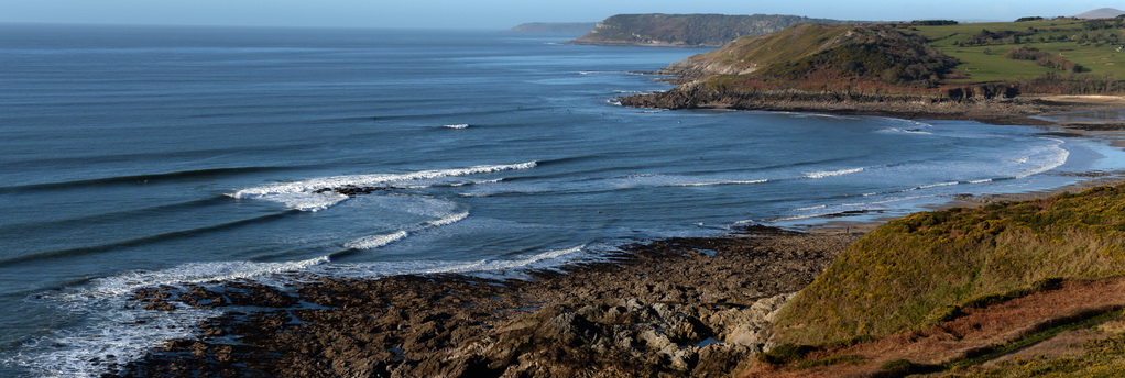 overview of surf fringed coastline gower