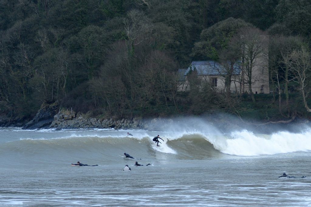 surfer in crowded waves